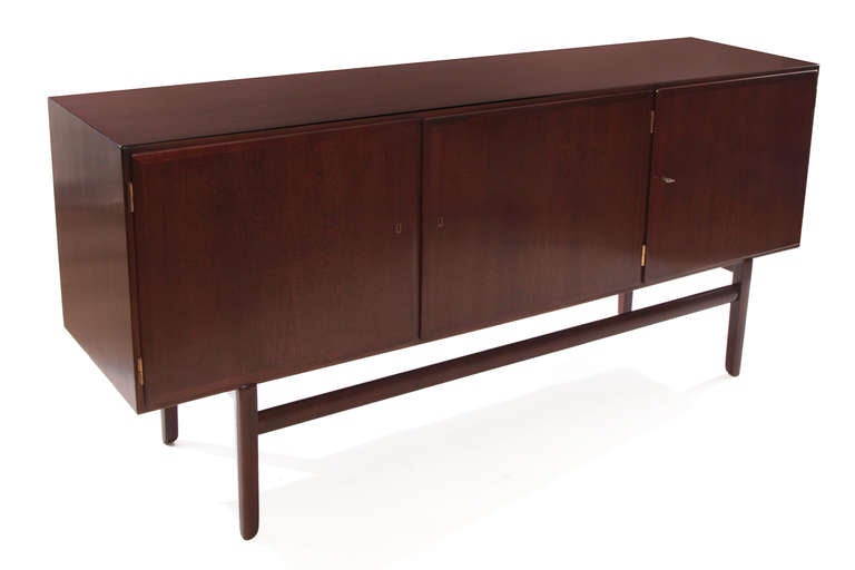 Stunning Ole Wanscher credenza from Denmark, circa late 1950s. This example has recently been impeccably restored and has seven interior drawers and two adjustable shelves. Please see red's other listings for the accompanying highboy.