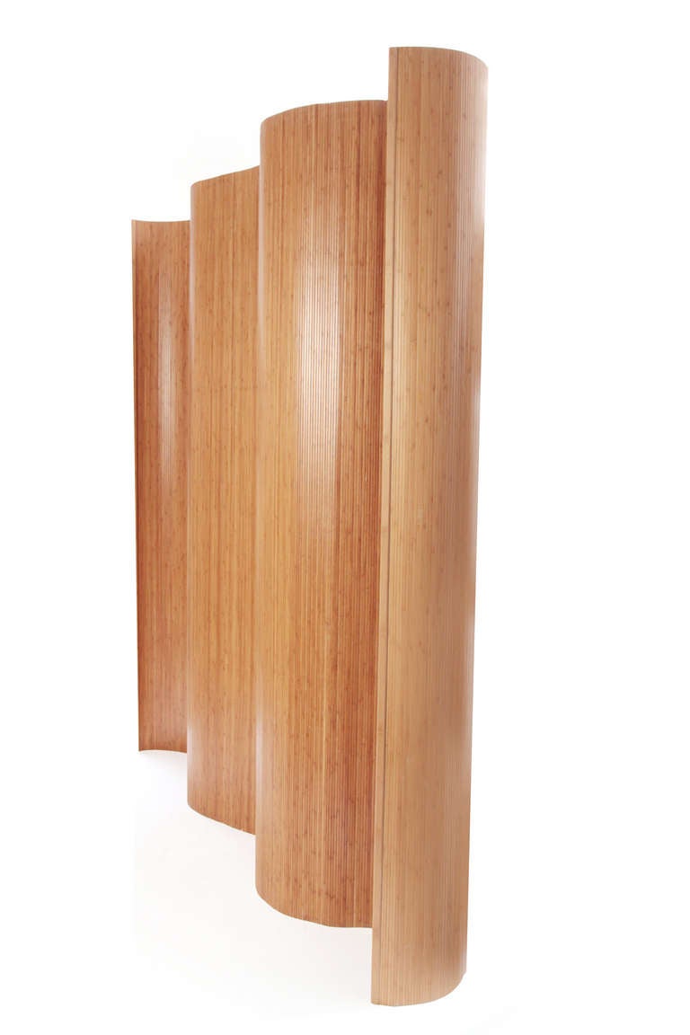 8' tall x 10' striated bamboo screen or room divider circa mid 1960's. This curvaceous example can be shaped to one's liking and stored away very easily. Please see Red's other listings for a matching screen in a darker finish.