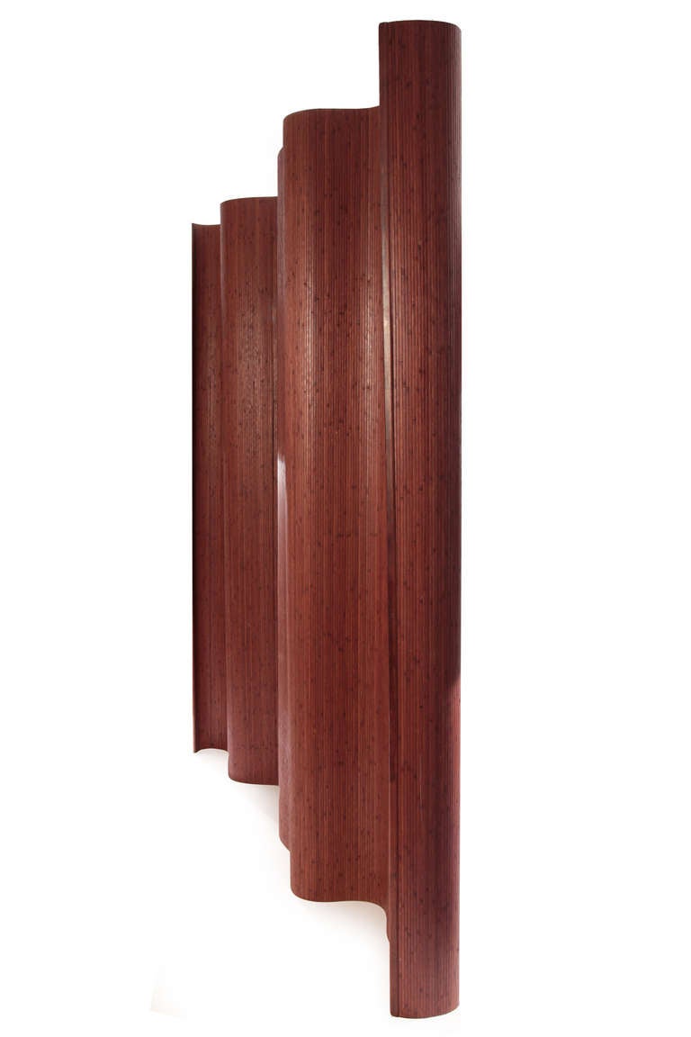 8' tall x 10' striated bamboo screen or room divider, circa mid-1960s. This curvaceous example can be shaped to one's liking and stored away very easily. Please see Red's other listings for a matching screen in a lighter finish.