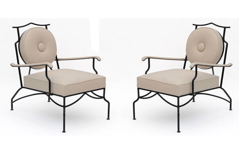 Striking pair of powder coated aluminum and upholstered lounge chairs circa late 1950's. These examples have been newly powder coated and upholstered in a bisque Sunbrella upholstery. They can be used indoors or out and are priced as a pair.
