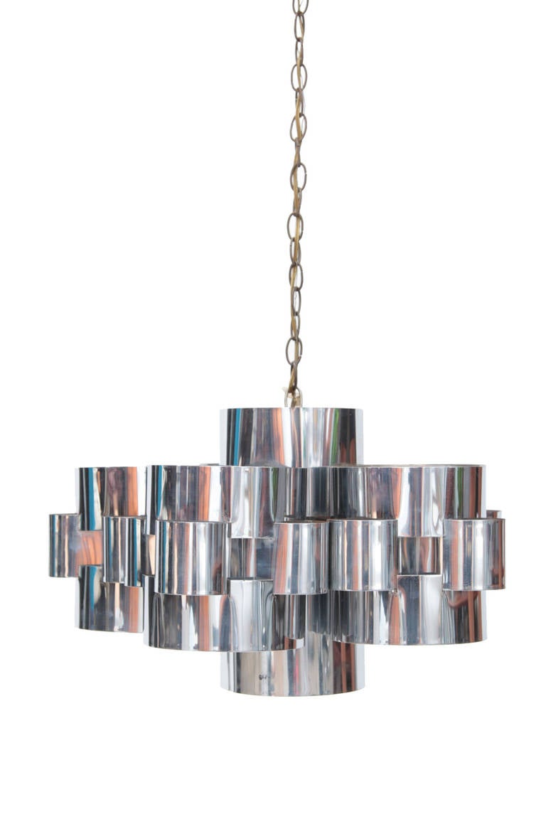 Curtis Jere inverted circles chandelier circa mid-1970s. This sculptural example is done in mirror polished chrome and is signed 