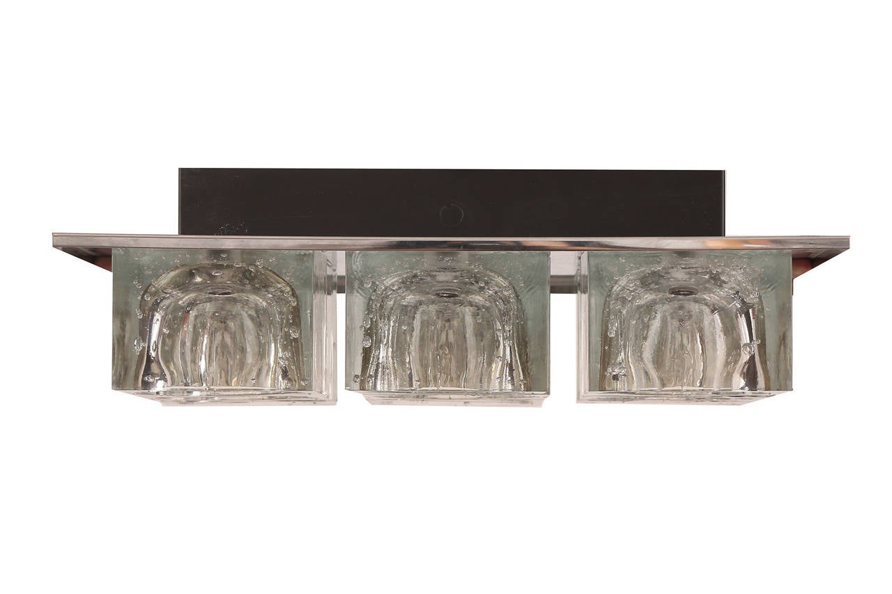 Pair of Gaetano Sciolari for Lightolier chandeliers, circa early 1970s. One of these examples has nine square crystal shades the other four. Price listed is for the nine crystal example. The four shade chandelier is $2600 and measures 5