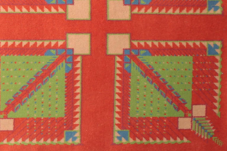 Rare rug or carpet custom made for the Arizona Biltmore, circa mid-1950s. Created by Taliesin Architects after Frank Lloyd Wright. This 7′ x 9′ example has been edge banded and has granny smith apple greens, blues maroons and Wrights famous red