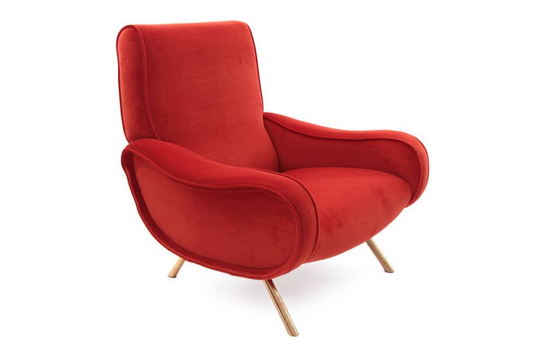 Fabulous Marco Zanuso lady chair, circa late 1950s. This example has sculptural subtly curved arms and tubular brass splayed legs. It has been newly upholstered in a stunning burnt orange Maharam velvet.