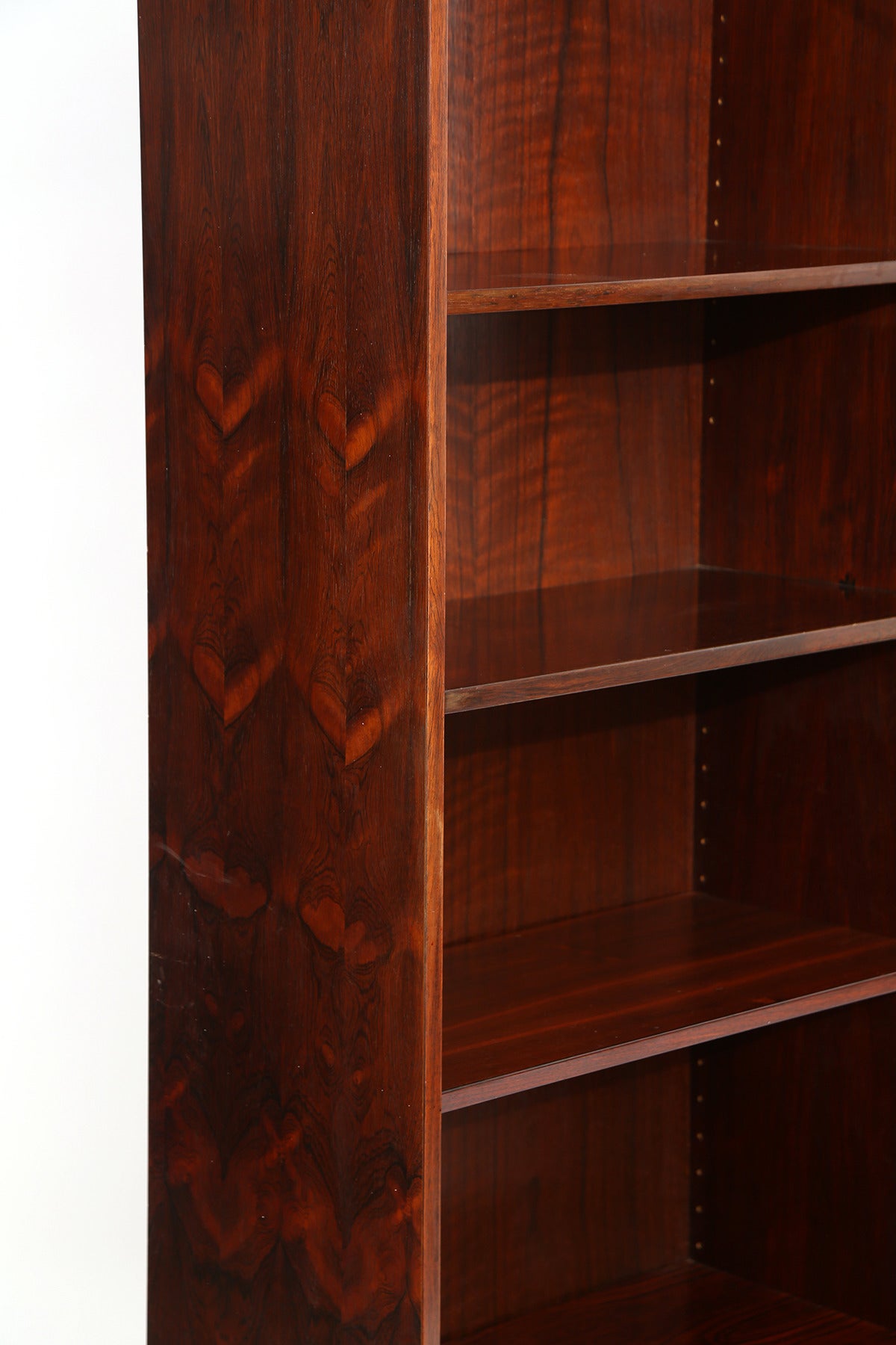 Large-scale Brazilian rosewood bookcase from Denmark, circa mid-1960s. This all original example has eight adjustable shelves and two that are built in. Beautiful graining to the rosewood case.