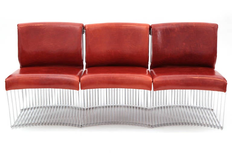 Verner Panton for Fritz Hansen Pantonova chairs, circa early 1970s. These sculptural examples can be used as individual chairs or put together to form a sofa. They have been newly upholstered in a lovely perfectly patinated persimmon leather. Price