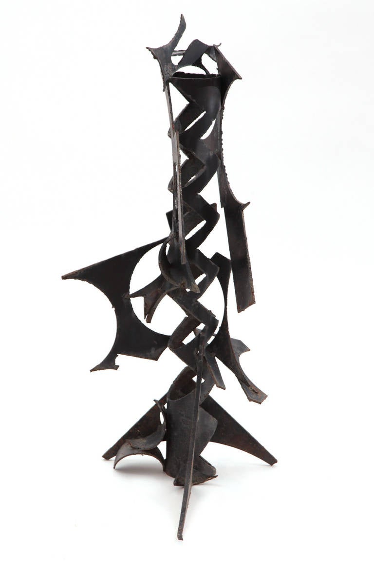 Large scale brutalist iron sculpture circa early 1960s. This free from example can be displayed vertically or horizontally and is fluid from every angle.