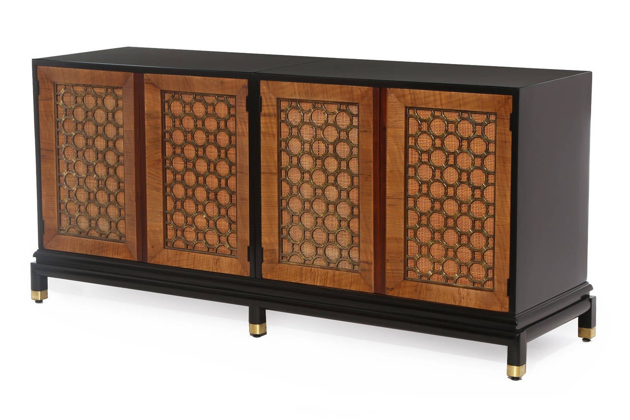 Extraordinary Renzo Rutili for Johnson brass and ebonized chest circa late 1950's. This example has been impeccably and painstakingly restored. The case and legs have been newly ebonized and the flame grained maple door trim refinished. The