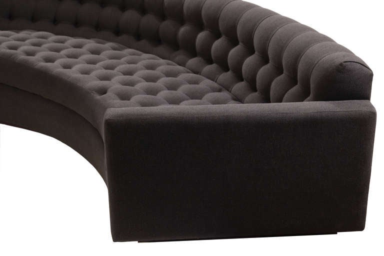 Stunning pair of Milo Baughman for Thayer Coggin biscuit tufted sofas circa early 1970's. These examples have been newly upholstered in an elegant felted charcoal gray upholstery and have rosewood plinth bases. Price listed is per sofa.