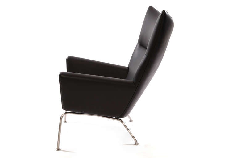 Hans Wegner for Carl Hansen & Son CH 445 leather lounge chair. This example was new in the box when we purchased it and literally has never been sat on. It is upholstered in stunning black Loke leather and is absolutely pristine.