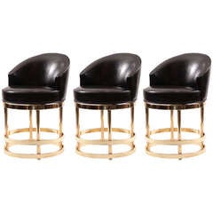 Three Leather and Mirror Polished Brass Swivel Counterstools