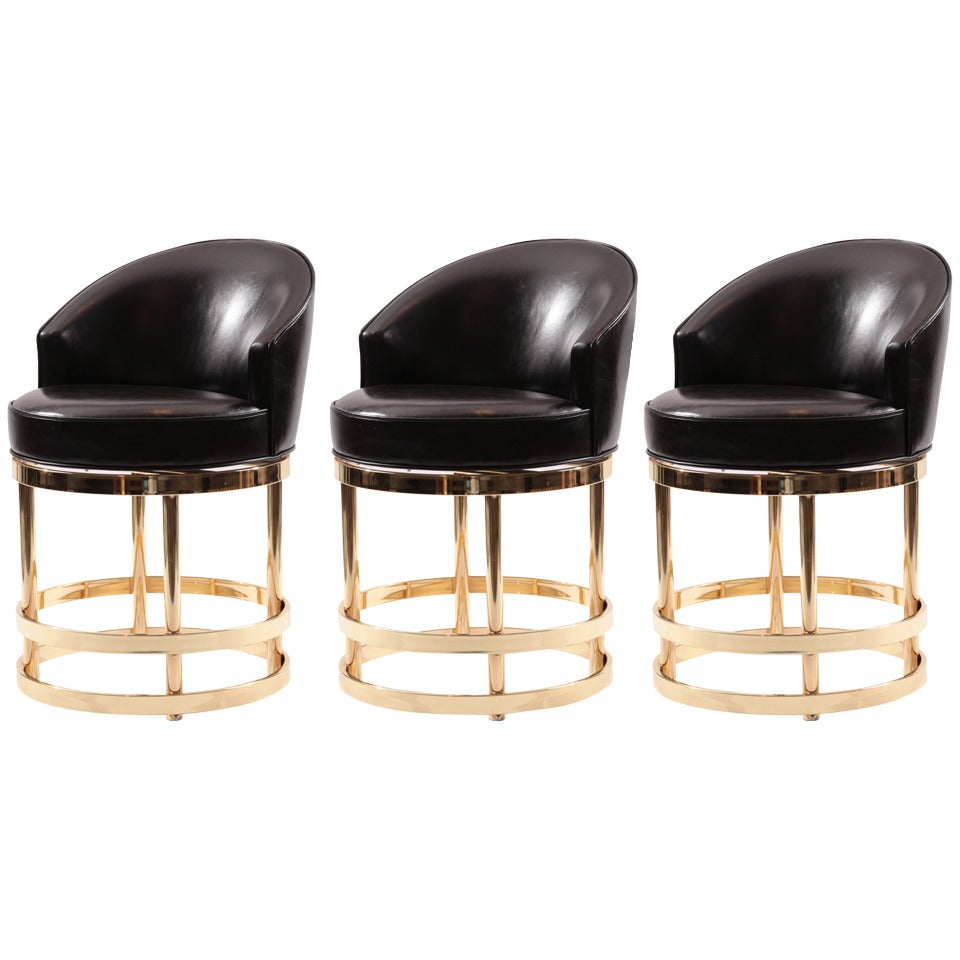Three Leather and Mirror Polished Brass Swivel Counterstools