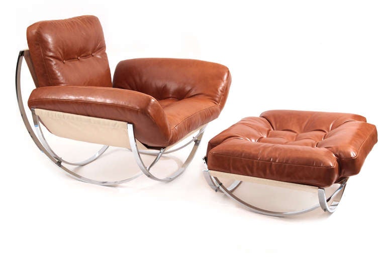 Massive butterscotch leather sunbrella and flat bar chrome lounge chair and ottoman from Italy, circa early 1970s. This fantastic example has been newly upholstered in a supple and elegant butterscotch leather with cream colored Sunbrella sling.