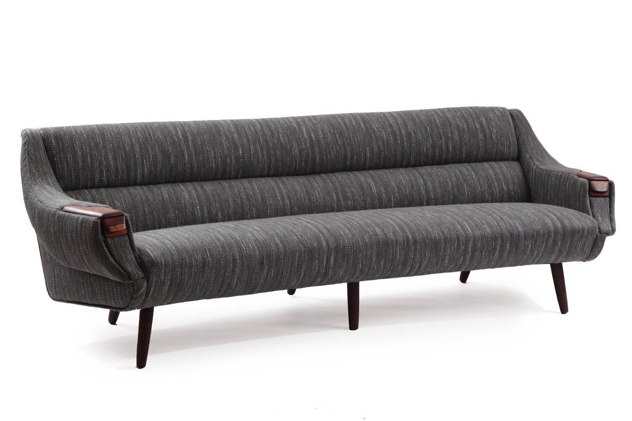 Free form sofa by H.W. Klein for Bramin circa late 1950's. This lovely example has been newly upholstered in a stunning Knoll textile with hues of grays blues and whites. Legs and arm details are solid rosewood. Notice the built in rosewood drawers..