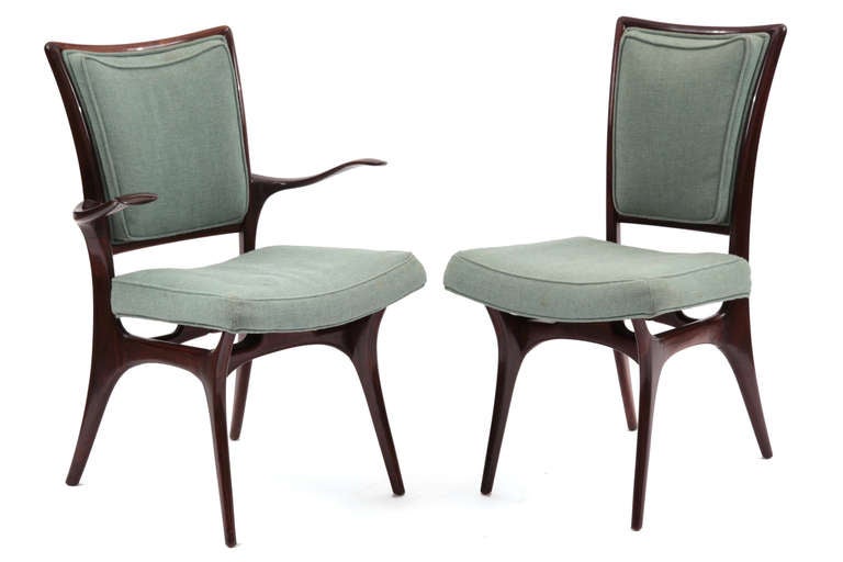 Rare set of four Vladimir Kagan for Kagan Dreyfuss chairs from 1950. These stunning examples have sculpted solid walnut frames and are upholstered in their original celadon green upholstery. Newly refoamed. These can be used as occasional chairs or