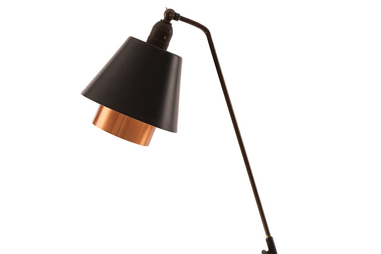 Wrapped metal brass and copper floor lamp from Sweden circa early 1960's. This sculptural example has an enameled metal frame with wrapped hairpin legs and stem with inset copper shade. Newly wired. Diameter of shade at the widest point is 6.75