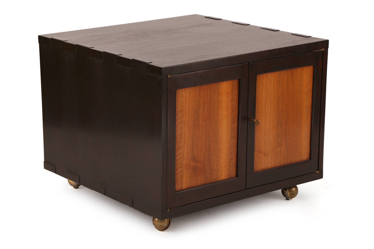 Rare Edward Wormley for Dunbar Janus chest #5811, circa early 1950s. This all original example has a solid dark walnut frame with large dove tail detailing and inset lighter walnut doors. Interior has one large drawer and open storage.