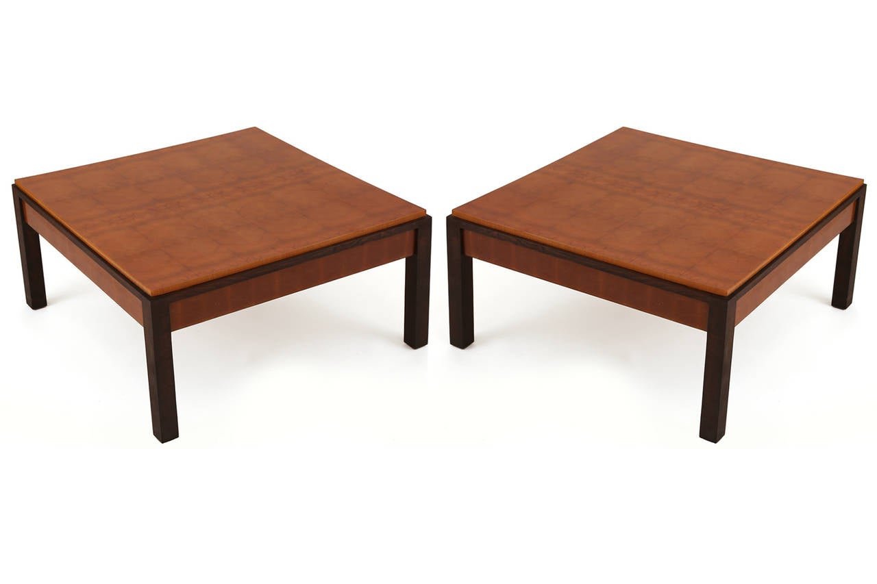 Pair of fabulously grained walnut side tables, circa late 1950s. These all original examples have book matched figural grained tops inset in dark walnut legs and stretchers. Price listed is for the pair.