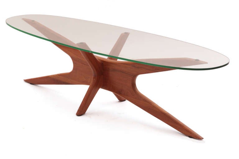 Sculptural walnut and glass cocktail table by Adrian Pearsall circa mid 1960's. This all original example has a beautifully formed solid walnut base with an oval glass top. Please see Red's other listings for other examples by Pearsall.