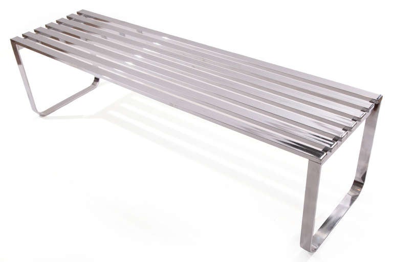 Milo Baughman slatted steel bench circa mid 1970's. This example has mirror polished slatted steel top with polished flat bar steel bases. Can be used as a bench or cocktail table.