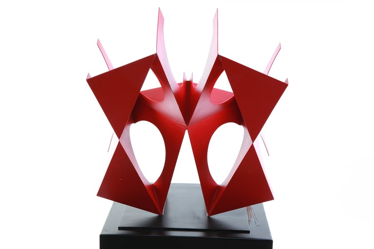 'Tlaloc' sculpture by Mexican artist Sebastian, circa early 1980s. This fabulous example uses organic and linear forms and striking red enamel to create a work that is striking from every angle. Unsigned.