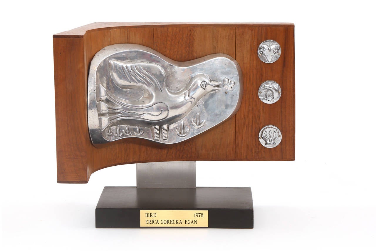 Rare cast aluminum and walnut sculpture by Erica Gorecka-Egan, circa 1978. Gorecka-Egan's work typically was two dimensional as she was a prominent illustrator. Her work was featured at the Museum of Modern Art in the 1940s. This example has cast