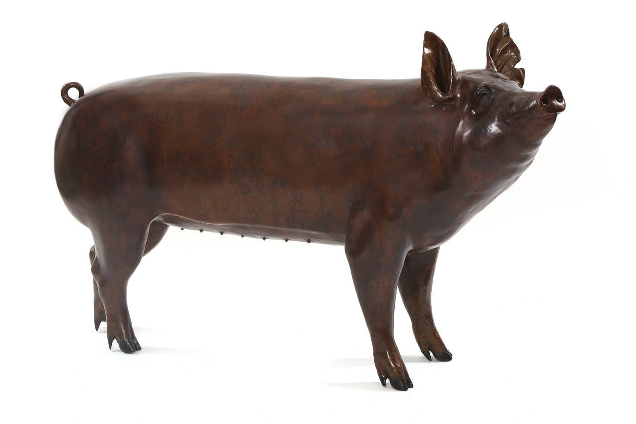 Lifesize bronze pig sculpture, circa mid-1960s. This massive realistic example can add whimsy and levity to any space. It has fabulous patina and presence.