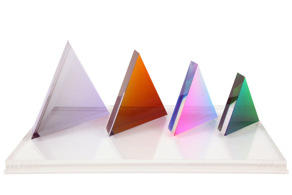 Vasa Mihich laminated acrylic sculpture circa 1979. This example has four multi colored triangular forms that sit on a lucite base. Each piece is signed and dated. The beauty of this sculpture is that it can be rearranged to your liking..