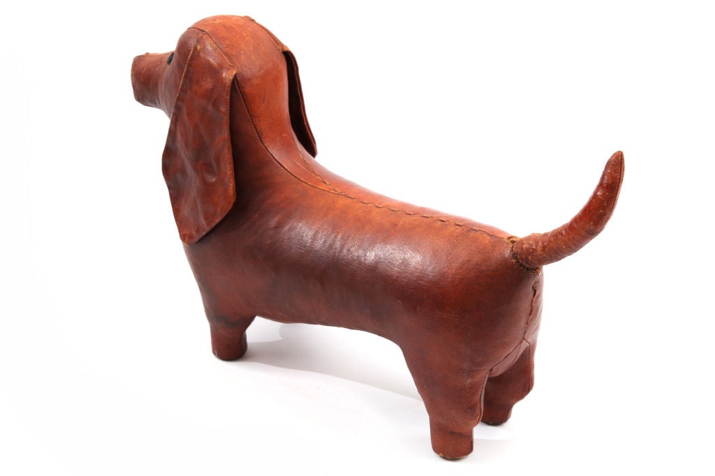 Abercrombie and Fitch leather dachshund ottoman circa 1950's. This example has a wonderful patina to the leather and can be used as a sculpture or foot stool.