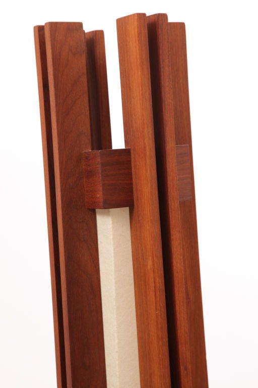 Custom solid walnut floor lamp circa mid 1960's. This studio example was commissioned by a Michigan designer and has the aesthetic qualities of Frank Lloyd Wright and George Nakashima. Red has acquired a dining table custom sofas benches and