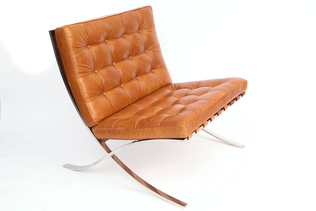 Early Mies Van De Rohe for Knoll Barcelona chair and ottoman circa late 1950's. This example has a stainless steel frame and is upholstered in a wonderfully patinated caramel leather. Price is for the chair and ottoman.