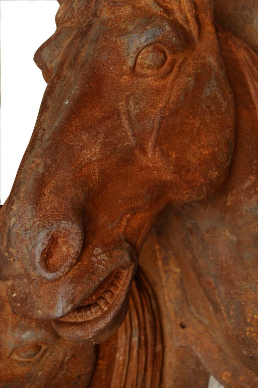 4 life size cast iron horse heads. These wonderfully patinated examples are wall mountable and can be sold as pairs or as a set of four. Price listed is for one head.