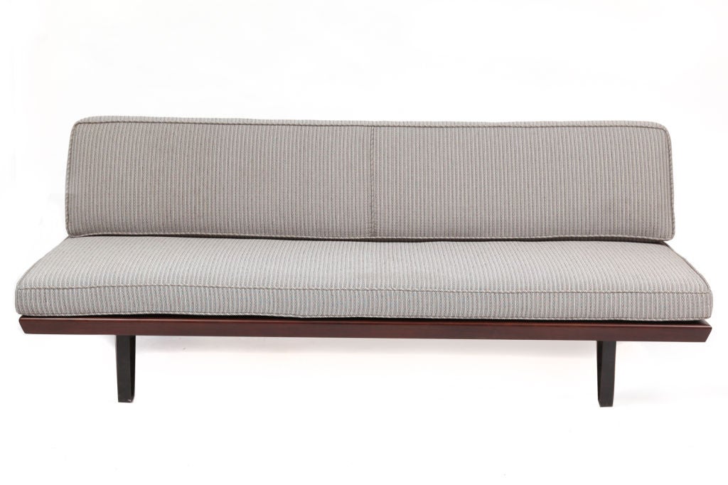 Mel Bogart for Felmore Associates daybed circa late 1950's. This example has solid iron hair pin legs and underside and solid oak frame and accents. It has been newly upholstered in a versatile and chic mixed gray textile. The base of the seat