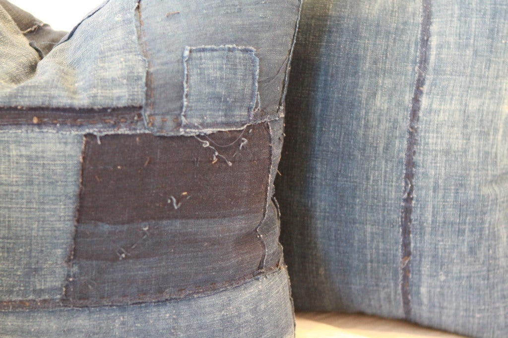 Pair of all indigo, hand-stitched, patched boro pillows.  feather and down inserts, zipper enclosure