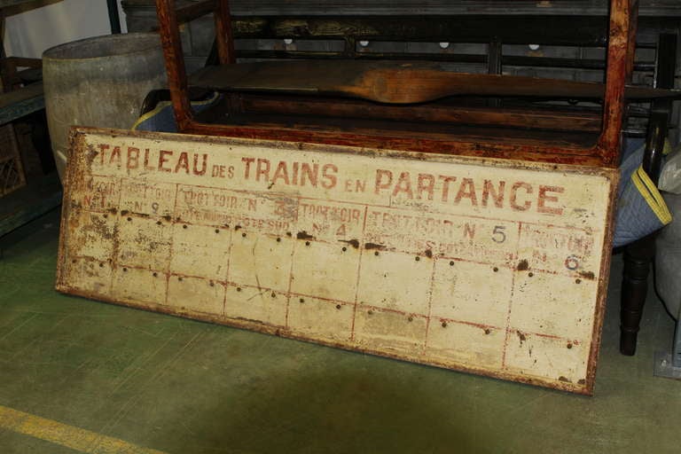 Vintage French train station schedule sign