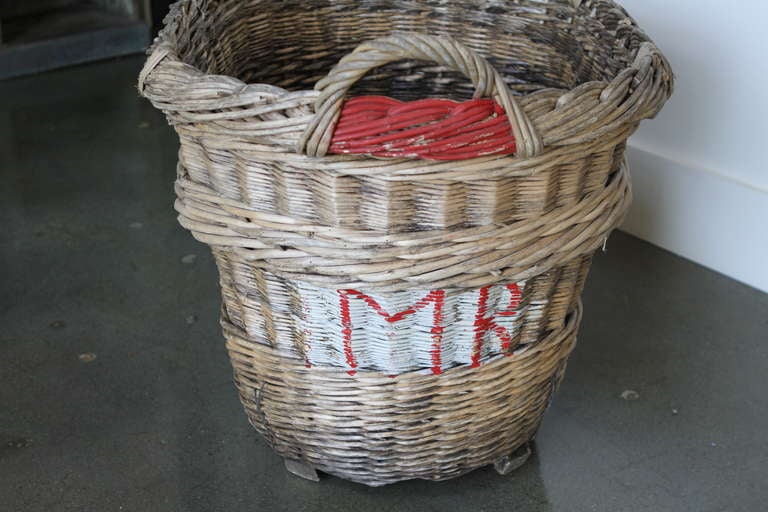 Old wicker Champagne basket with red paint and initials