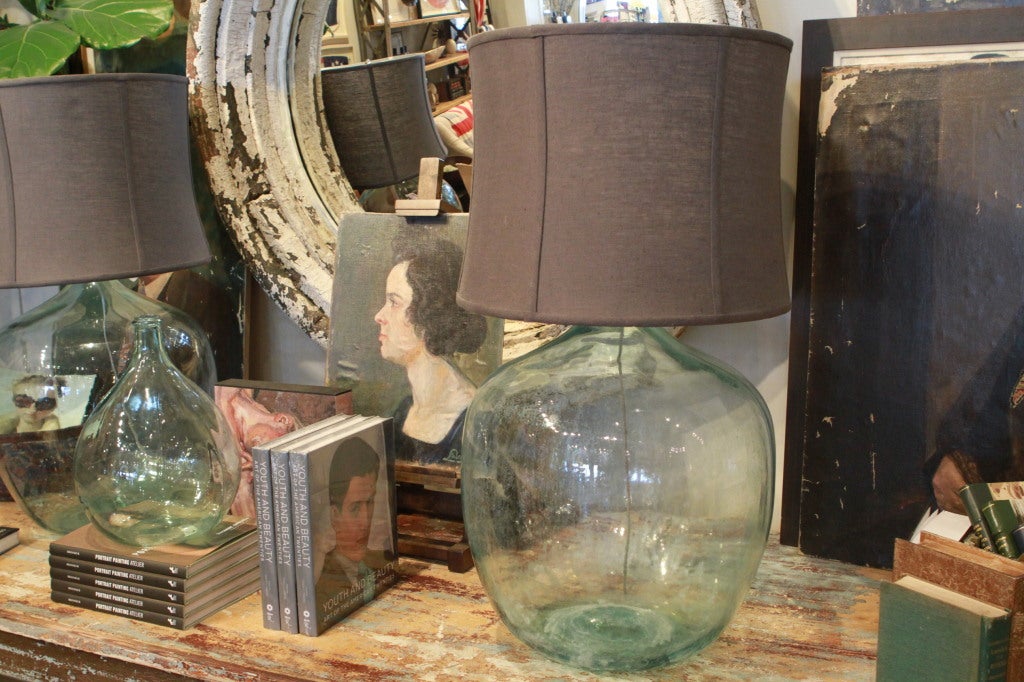 Beautiful pair of large glass wine bottle lamp bases.  Newly wired.  Shades not included {other options available}