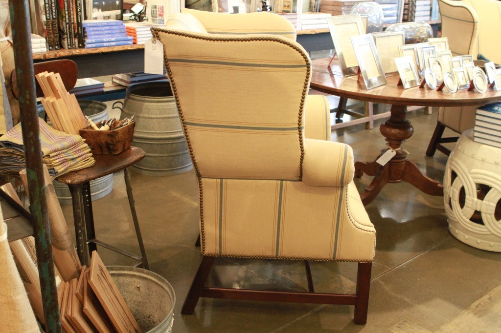 Pair of Ralph Lauren Hudson Valley Wing chairs, upholstered with nailheads in Ralph Lauren linen stripe