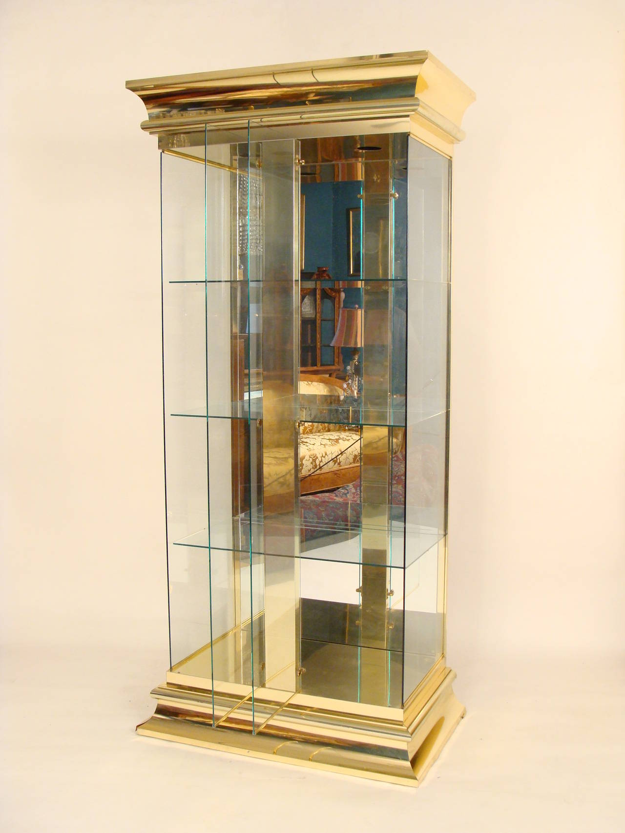 Contemporary brass and glass display cabinet attributed to Mastercraft.