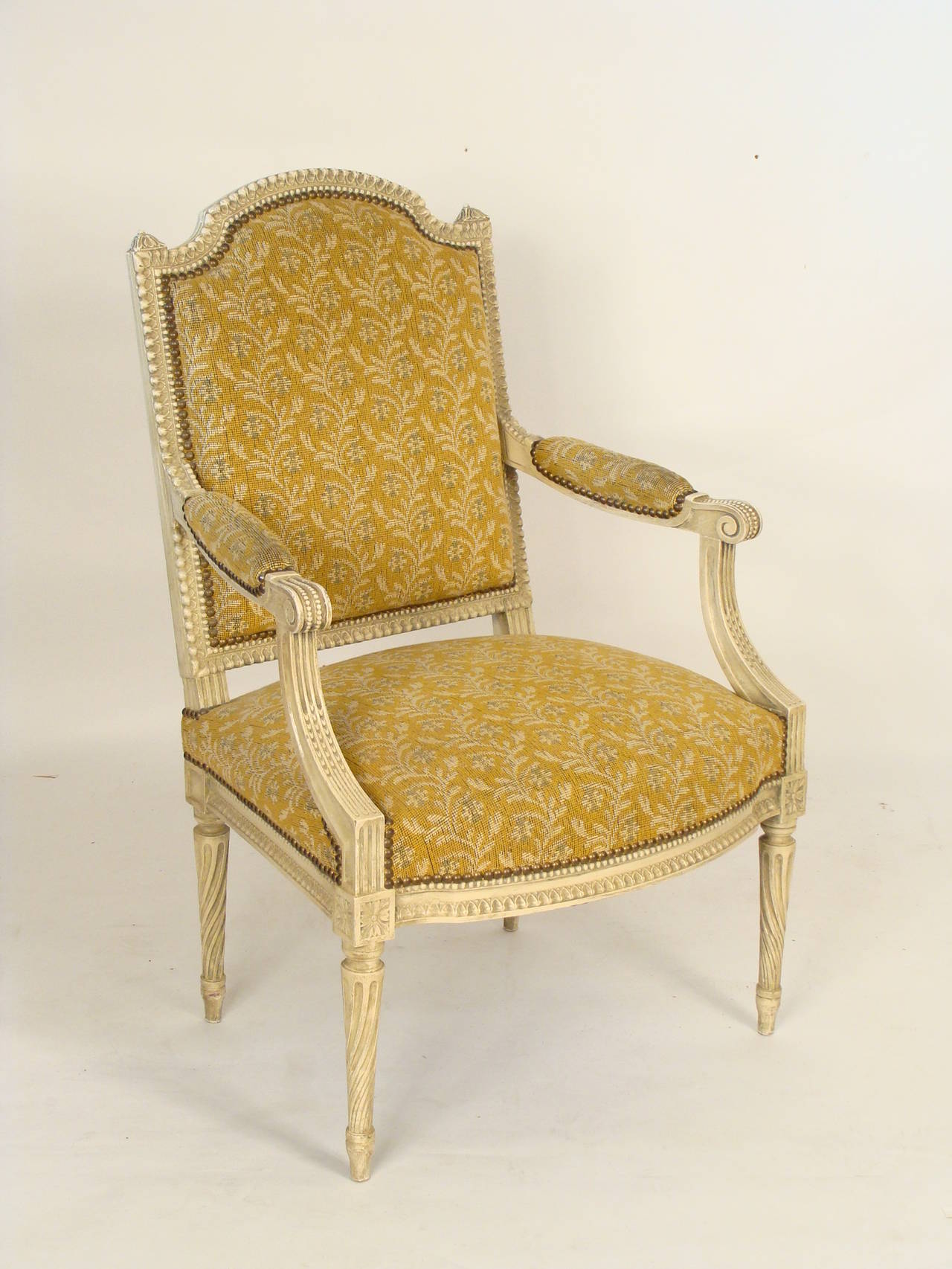 Pair of painted Louis XVI style open armchairs, approximately 50 years old.
