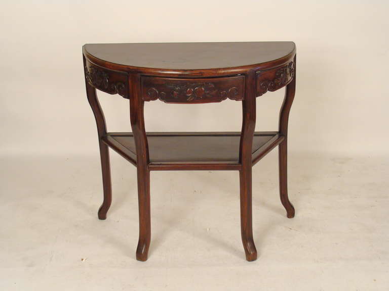 Chinese demi lune teakwood console table, mid 20th century. This table has very nice color and understated carving. When inquiring about this table please refer to store inventory #15054.