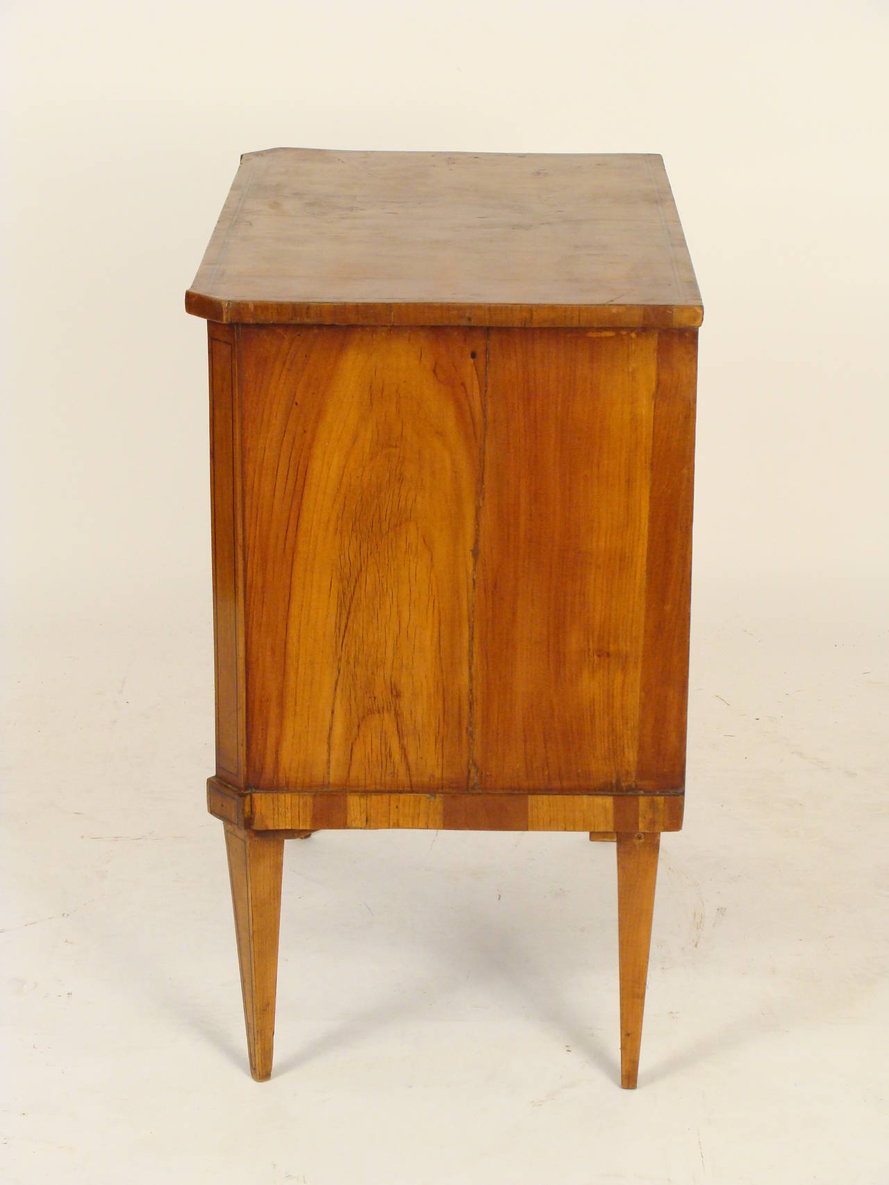 Continental directoire, fruit wood, small scale, two drawer commode, early 19th century. This is a hard to find small scale chest of drawers.
