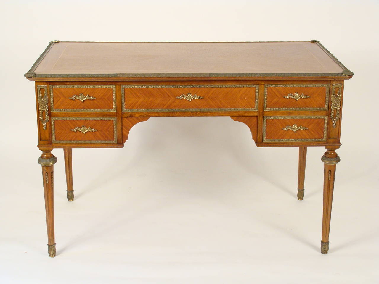 Louis XVI style mahogany brass-mounted desk made, circa 1970. Quality construction with dovetailed drawers.