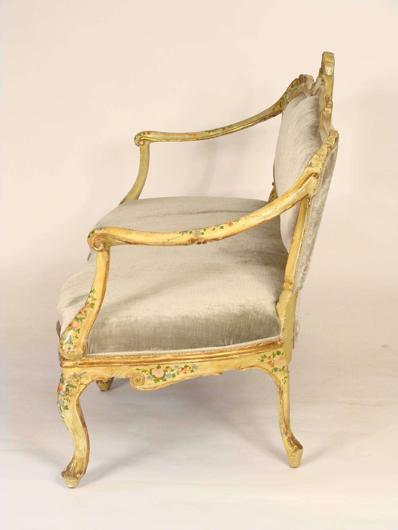 Painted Italian Louis XV style settee, circa 1920. Having nice old original paint. This settee has a deep seat which makes it very comfortable.