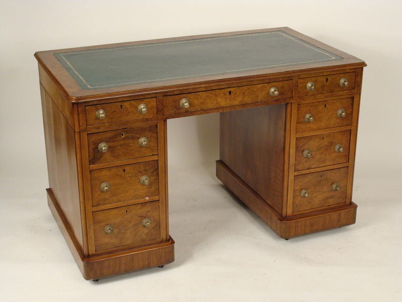George lll style burl walnut and burl elm double pedestal desk with a tooled leatherette top, circa 1900.