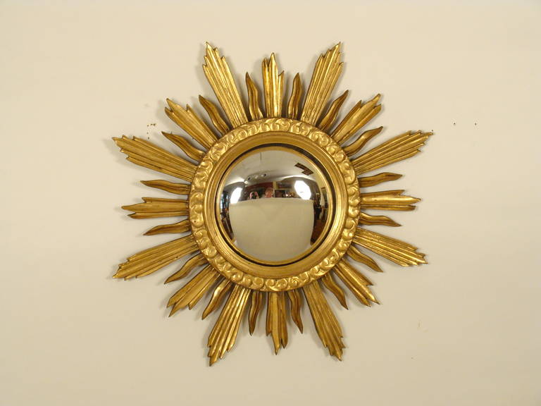 Giltwood sunburst mirror with convex glass, mid-20th century.