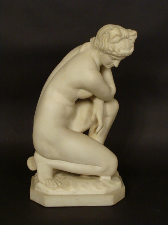 Marble statue of Venus kneeling