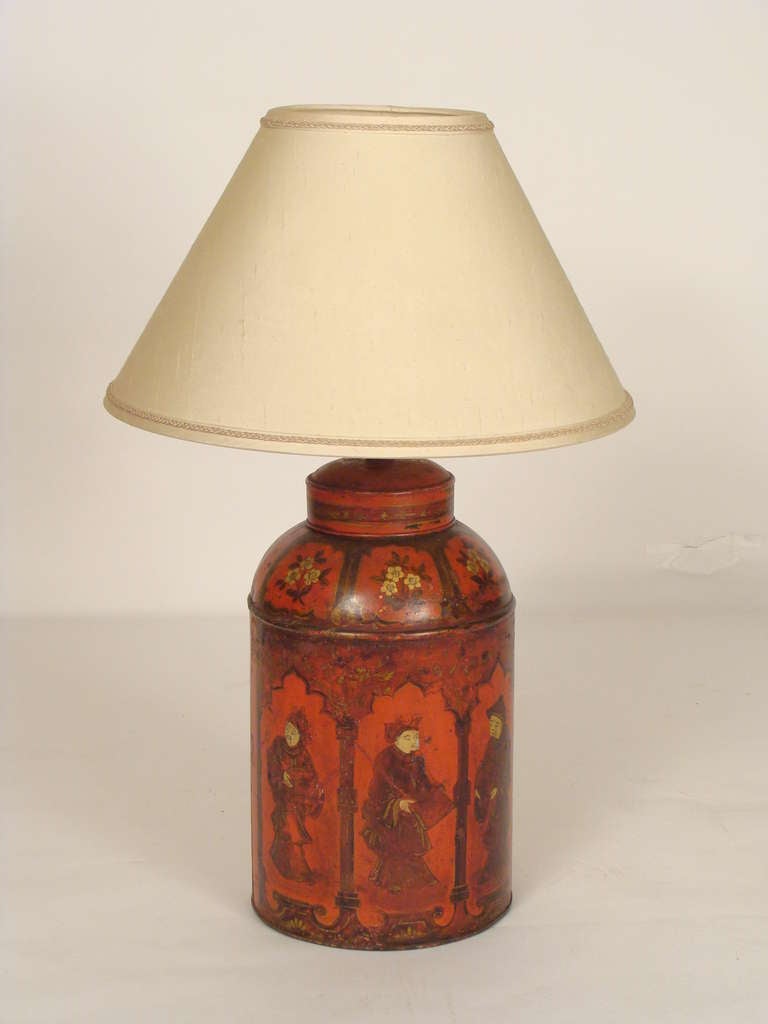19th century red tole tea canister lamp with Chinese figures. The height to top of the shade is 31