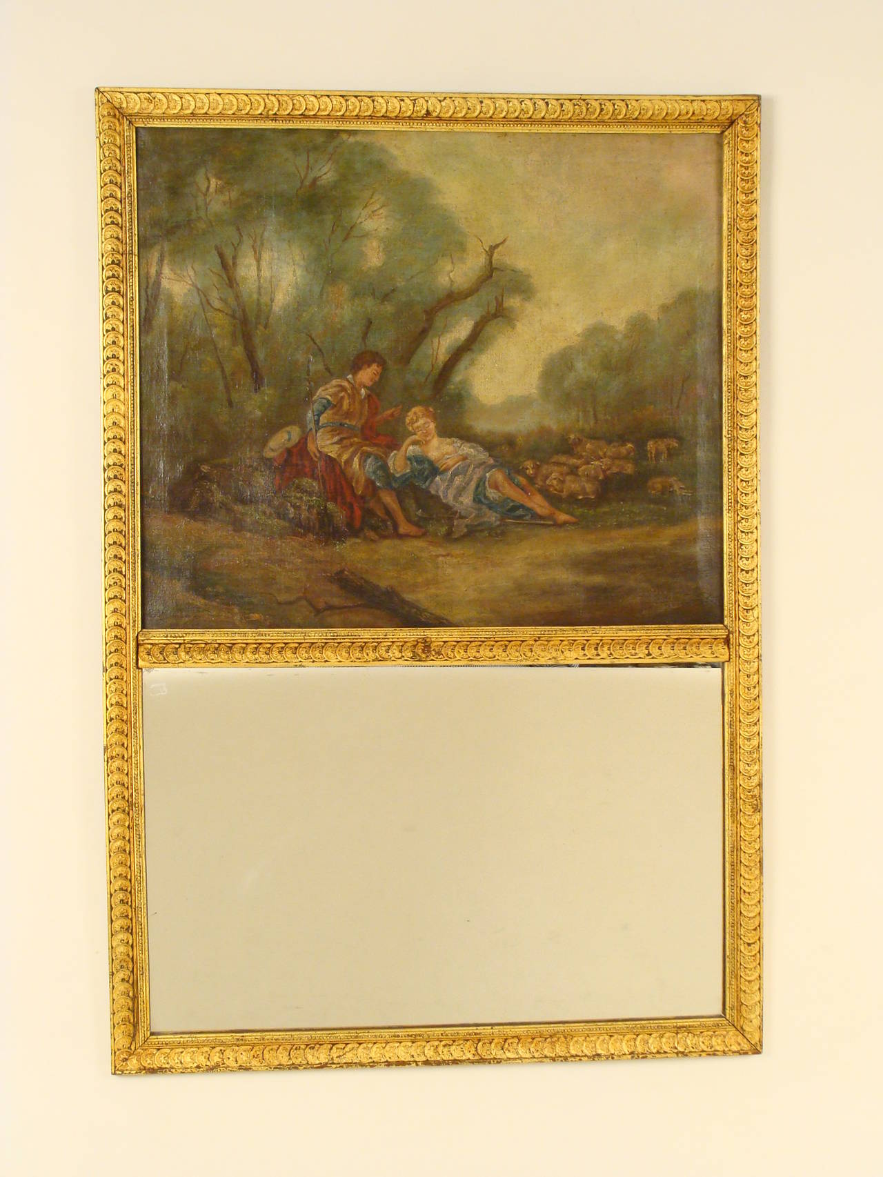 Louis XVI style gilt decorated trumeau mirror, 19th century. The painting is signed in the lower left hand corner. The painting is likely older than the mirror frame.