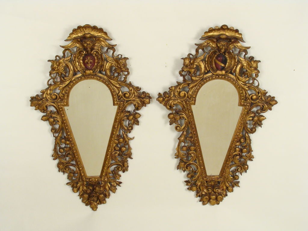 Pair of Italian Baroque style giltwood mirrors, late 19th century.